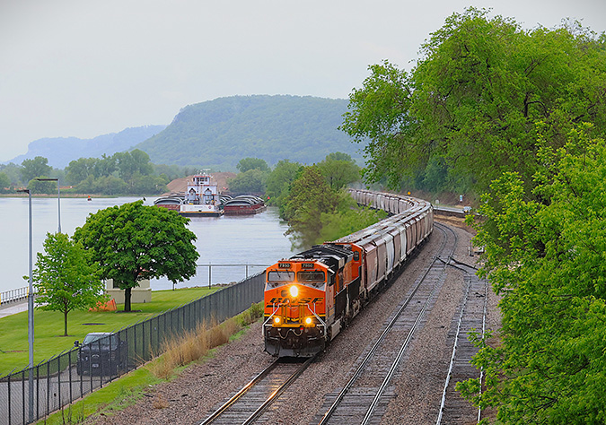 A grain shuttle travels along the Mississippi River near Alma, Wisconsin.