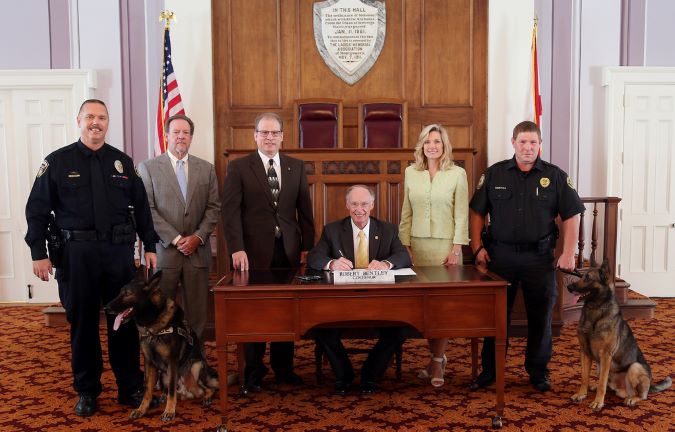 Railroad Police K-9 Protection Bill signing by Alabama Governor Robert Bentley. BNSF Senior Special Agent Bryan Schaffer and Faust are at left.
