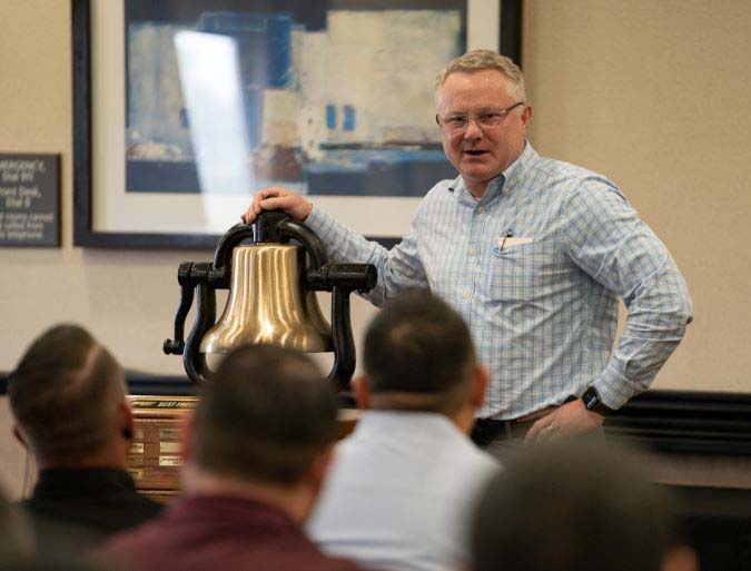 Executive Vice President and Chief Operations Officer Matt Igoe at a bell presentation.
