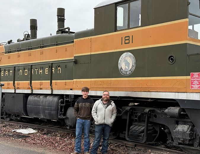 Xander and his dad in front of an old Great Northern switch engine at BNSF’s depot in Whitefish. Xander and his dad in front of an old Great Northern switch engine at BNSF’s depot in Whitefish.
